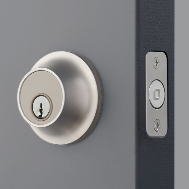 Closeup of Level lock installed in dark gray door