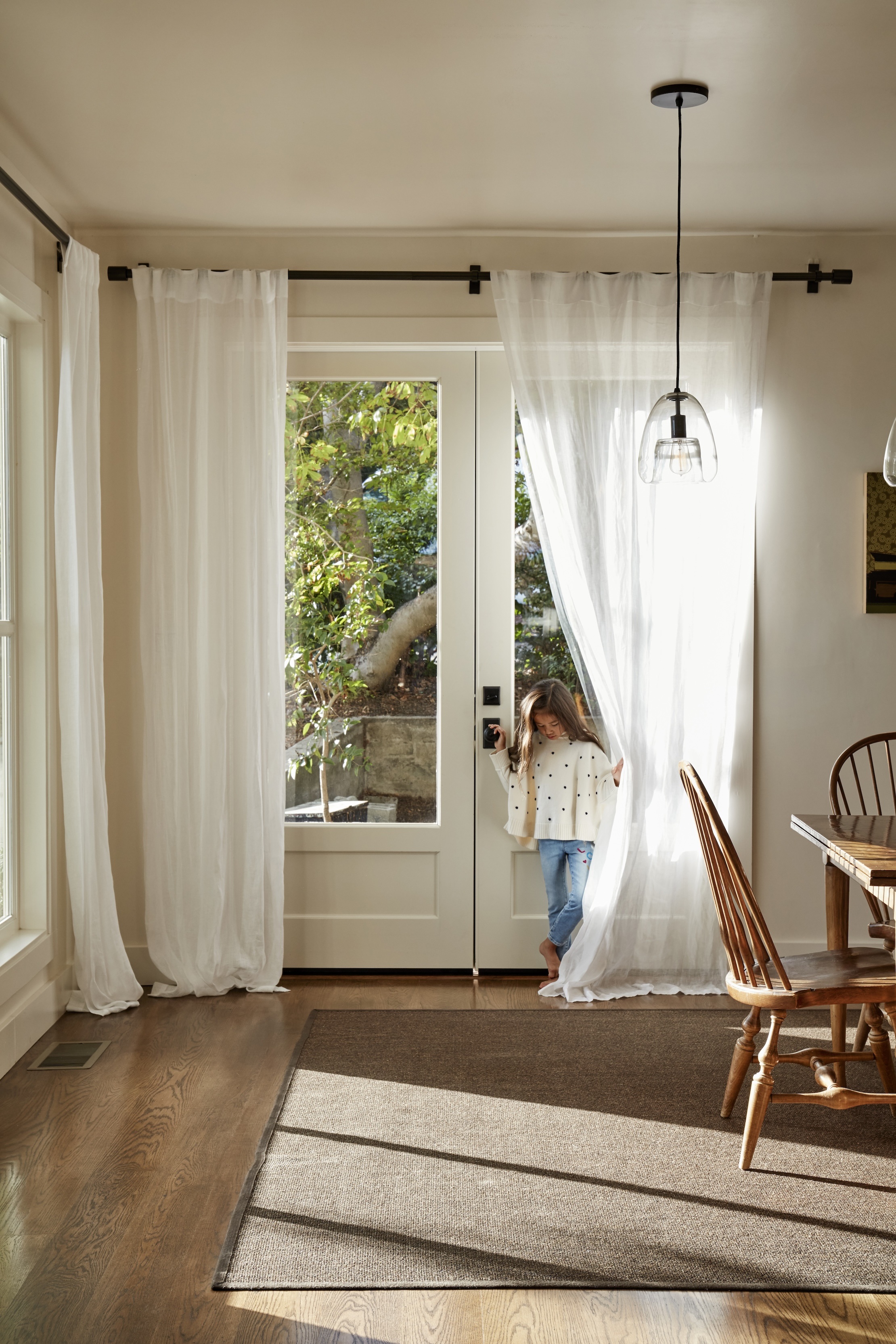 Backdoor With Sheer Curtains Letting In Light